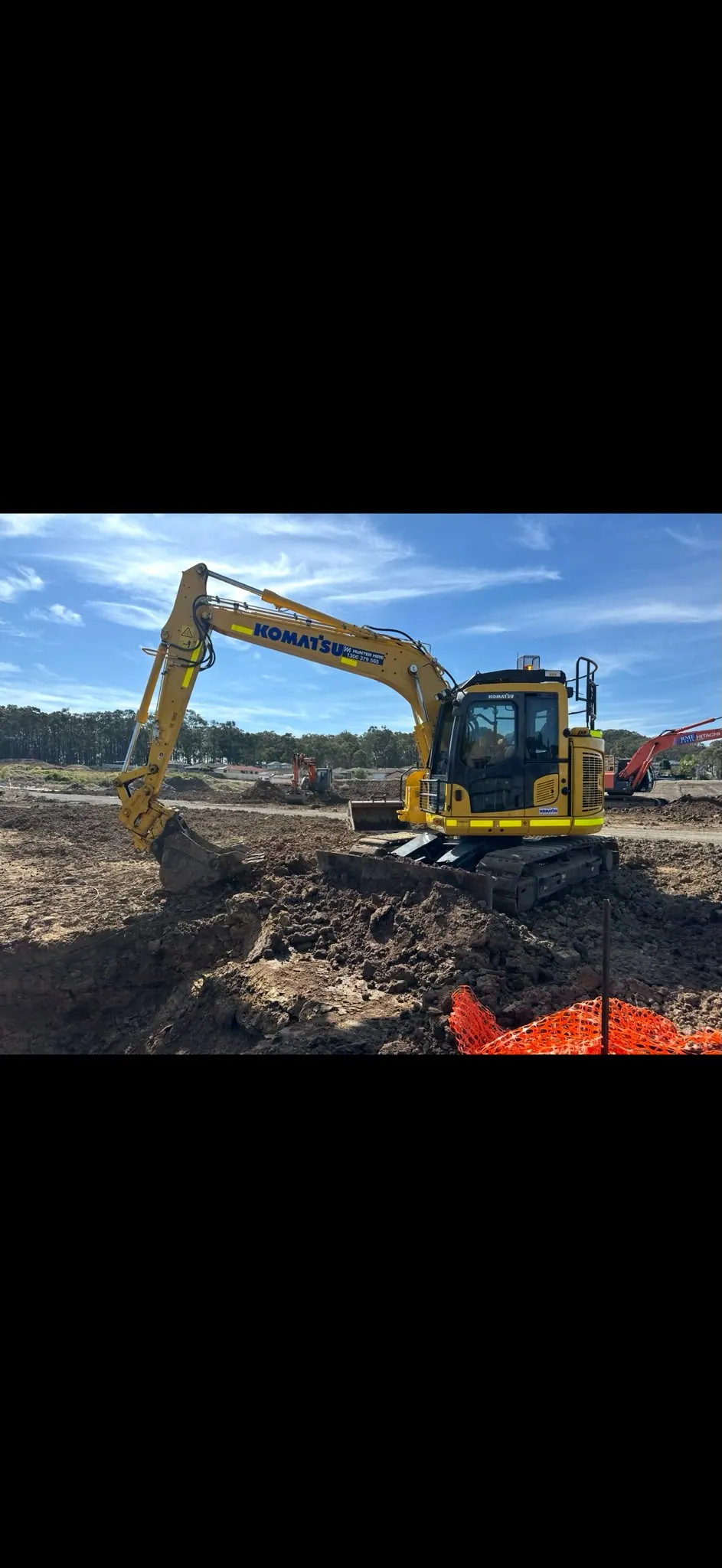 Excavator on an open earthworks site