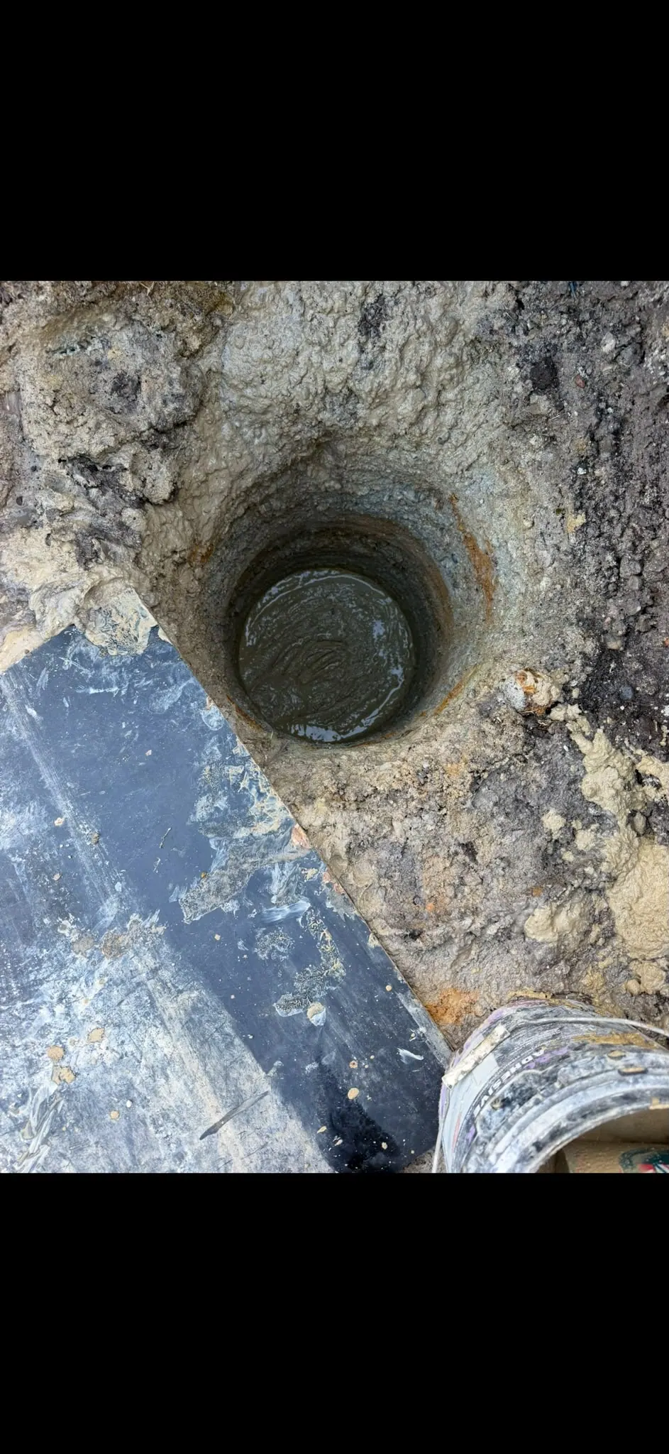Augered hole in the ground