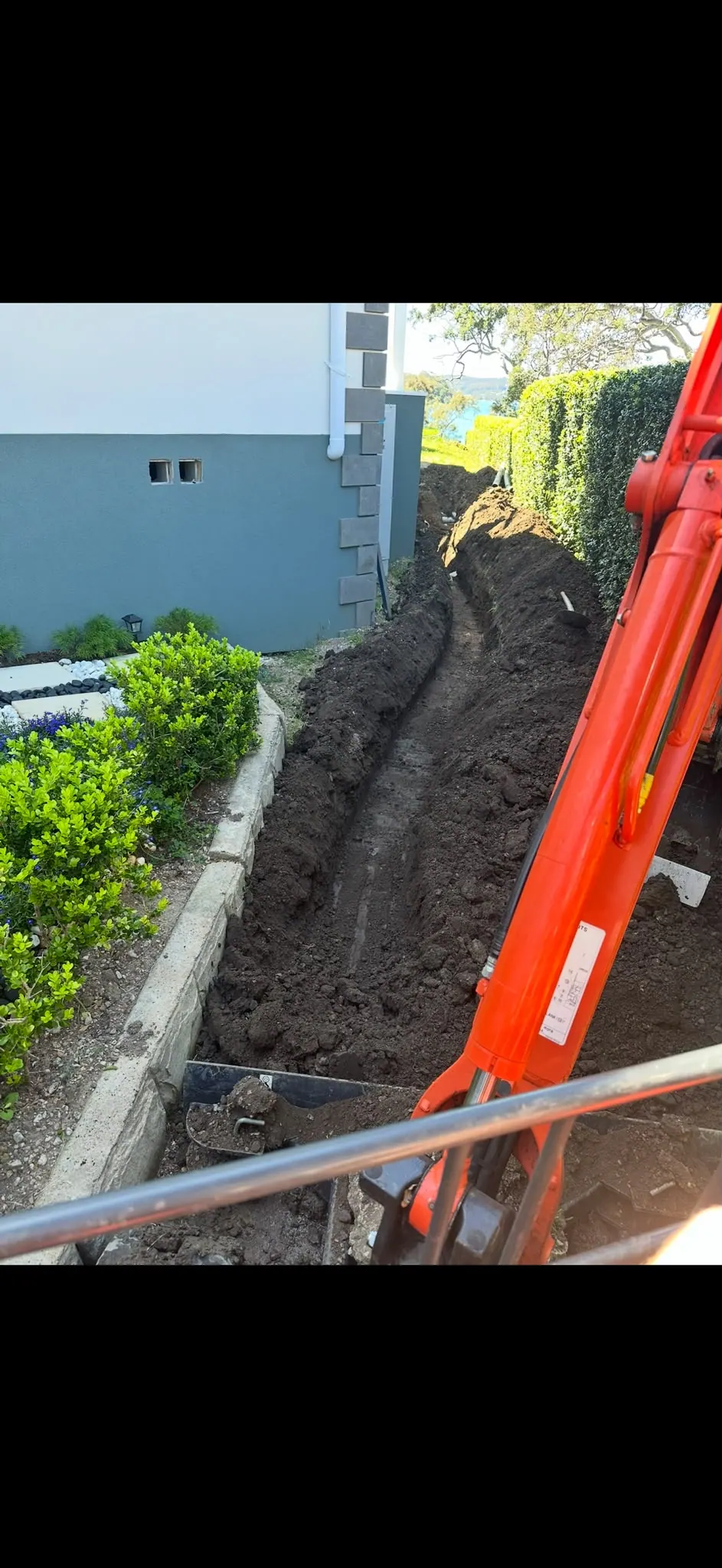 Trenching between a house and garden