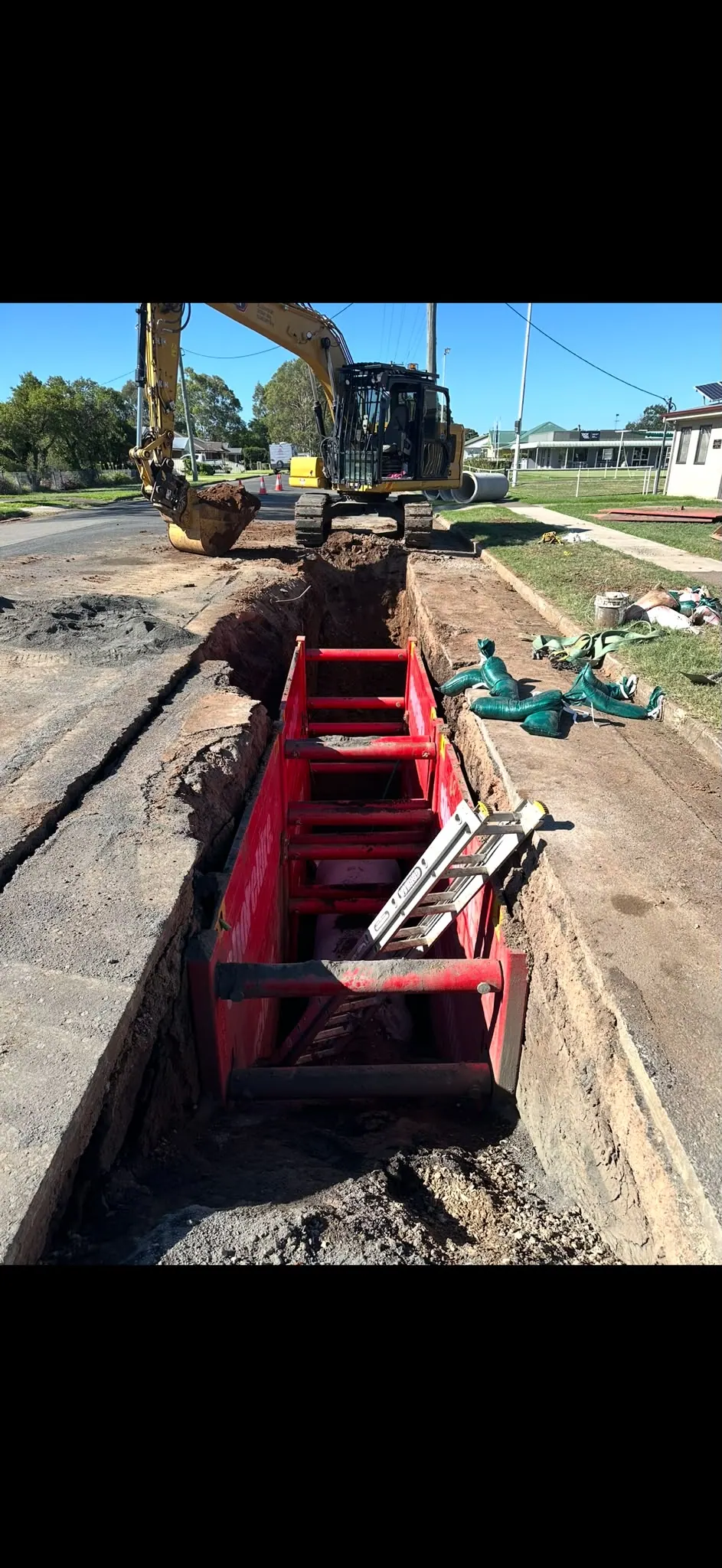 Supported trench with access ladder