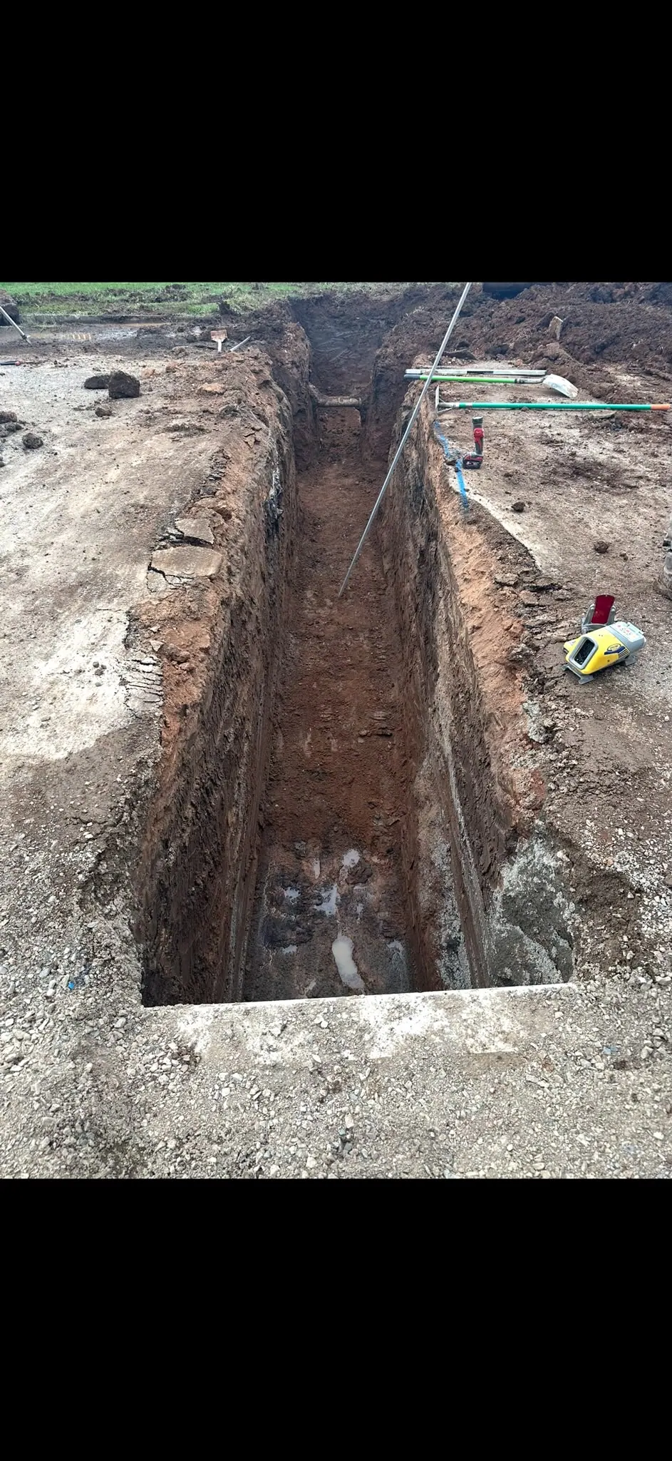 Straight trench excavation through road surface